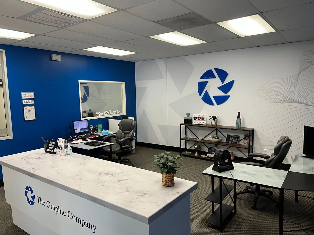 A reception area with a desk and computer.