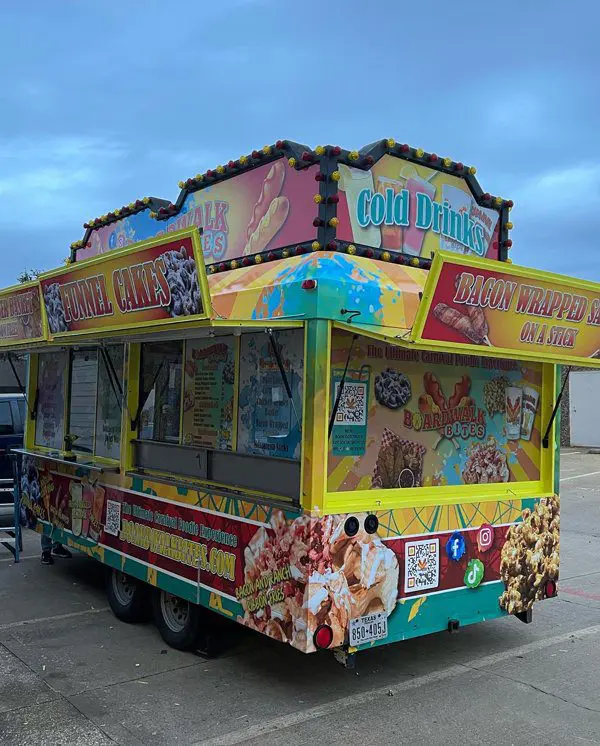 A food truck parked in the parking lot.