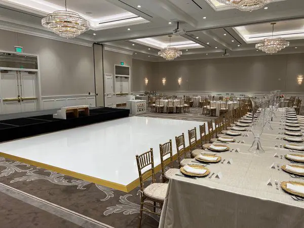 A large banquet hall with tables and chairs.