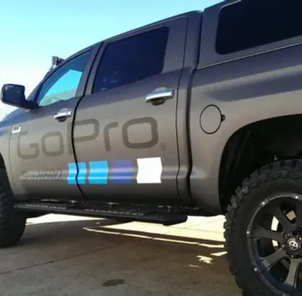 A truck with the word gopro on it's side.