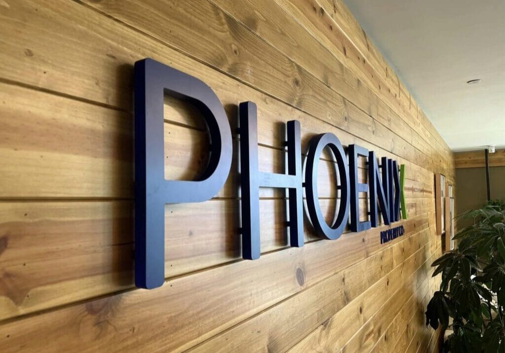 A wooden wall with the name " phoenix ".