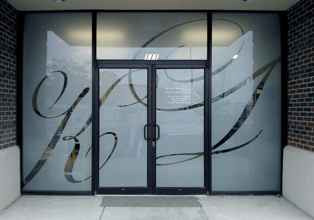 A glass door with some writing on it